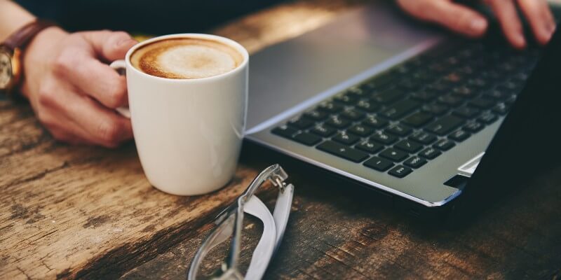 on-leptop-with-coffee