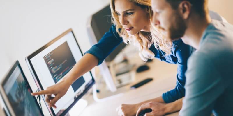 team-members-looking-on-computer